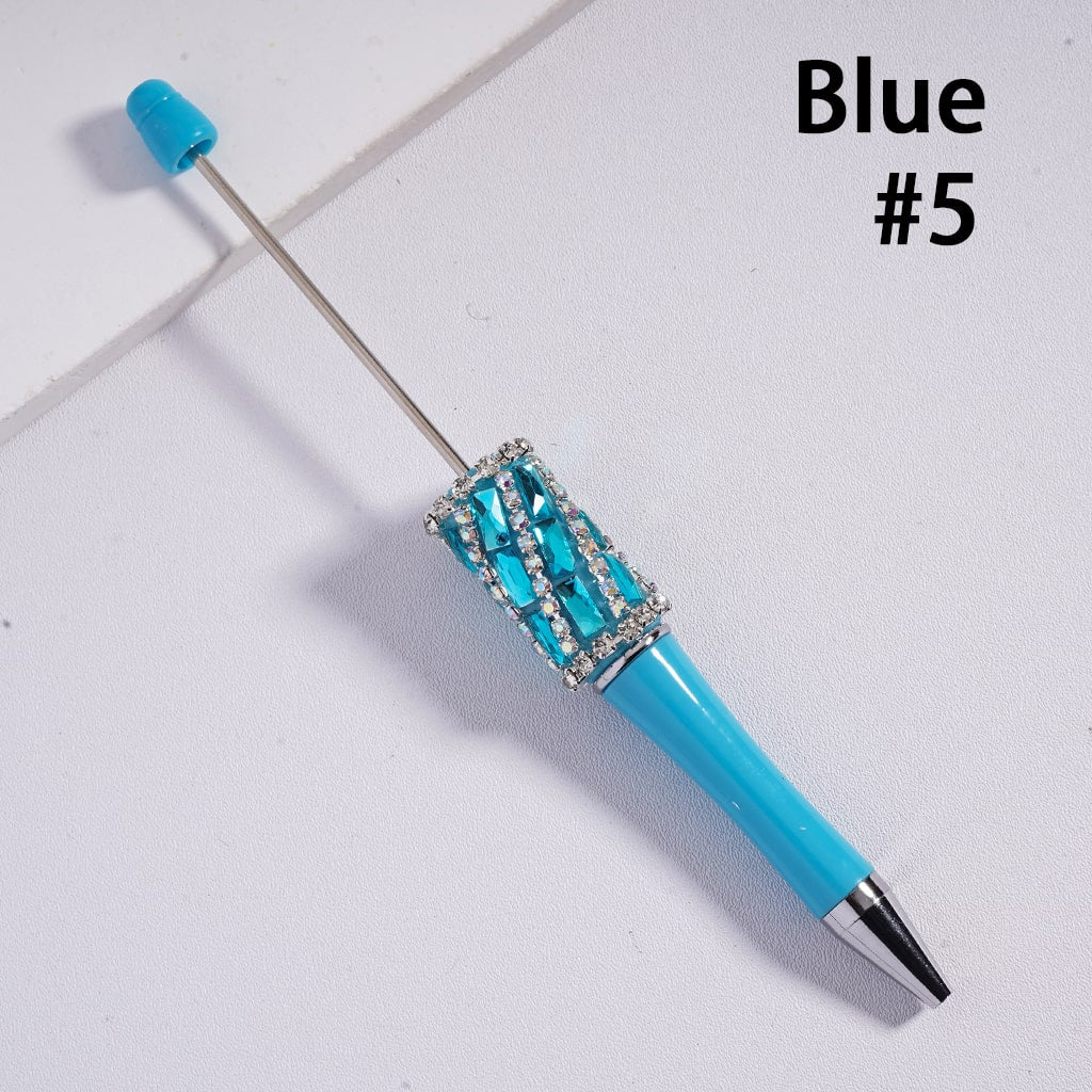Blue pen with decorative elements on a light gray background