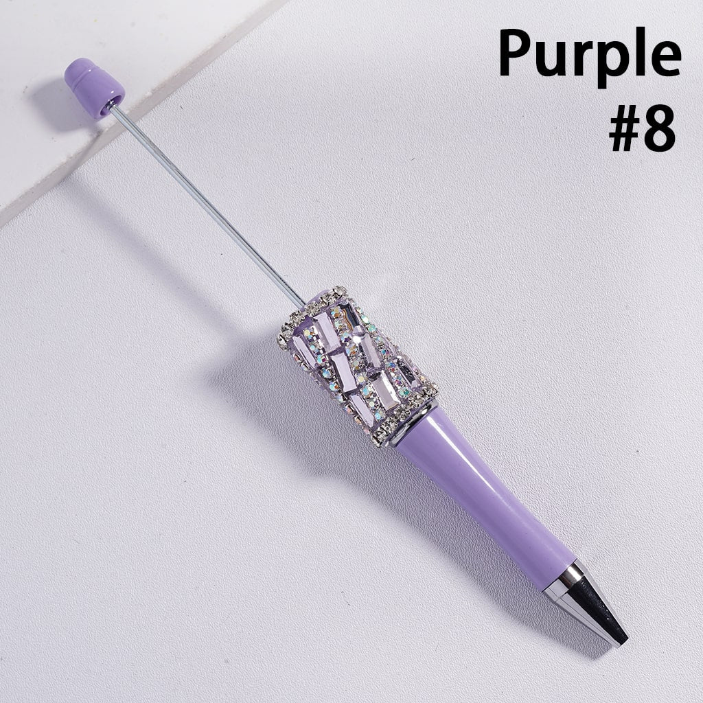 Purple pen with decorative cap on a light gray background