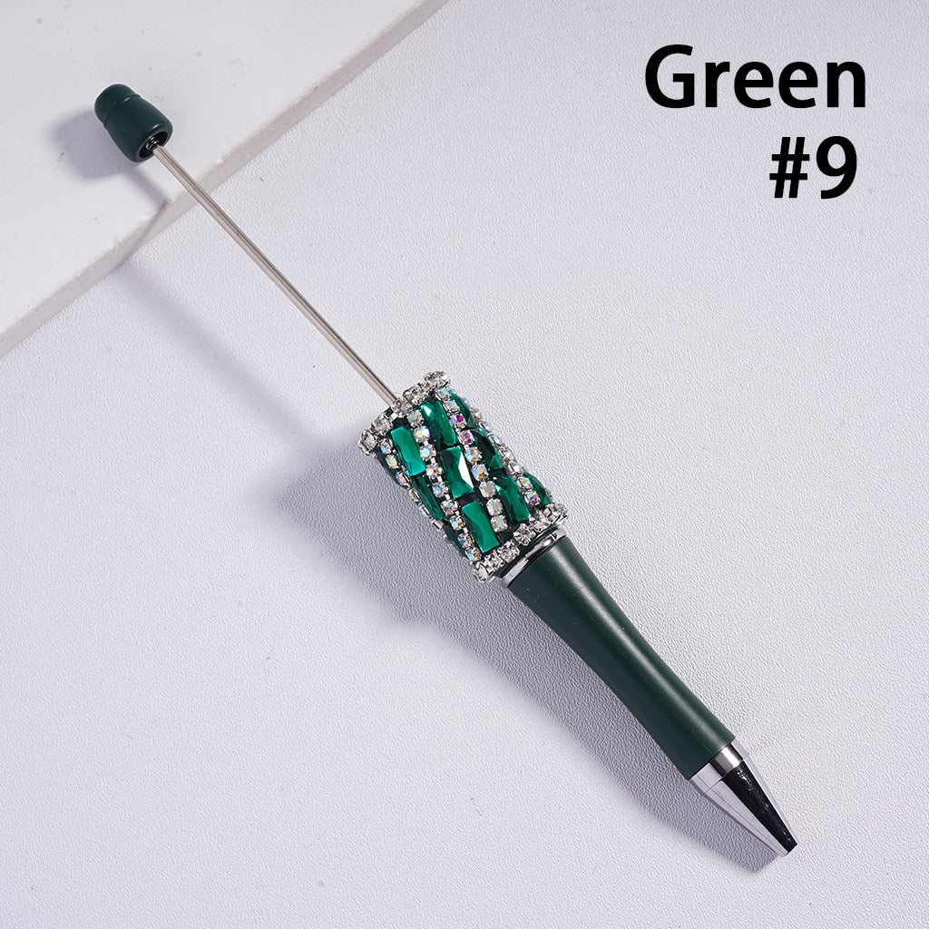 Green pen with decorative top on a light gray background