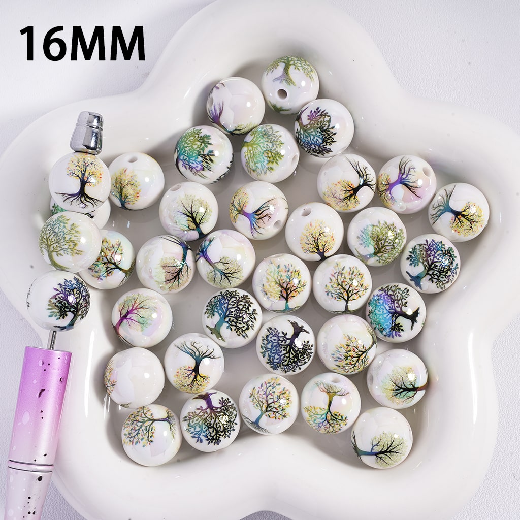 16MM round beads with tree designs on a white dish