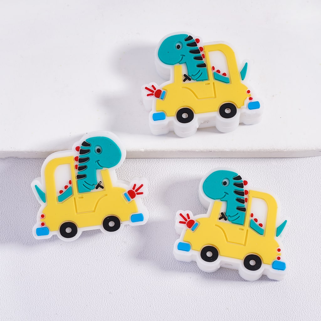 Three colorful dinosaur toy cars on a white background