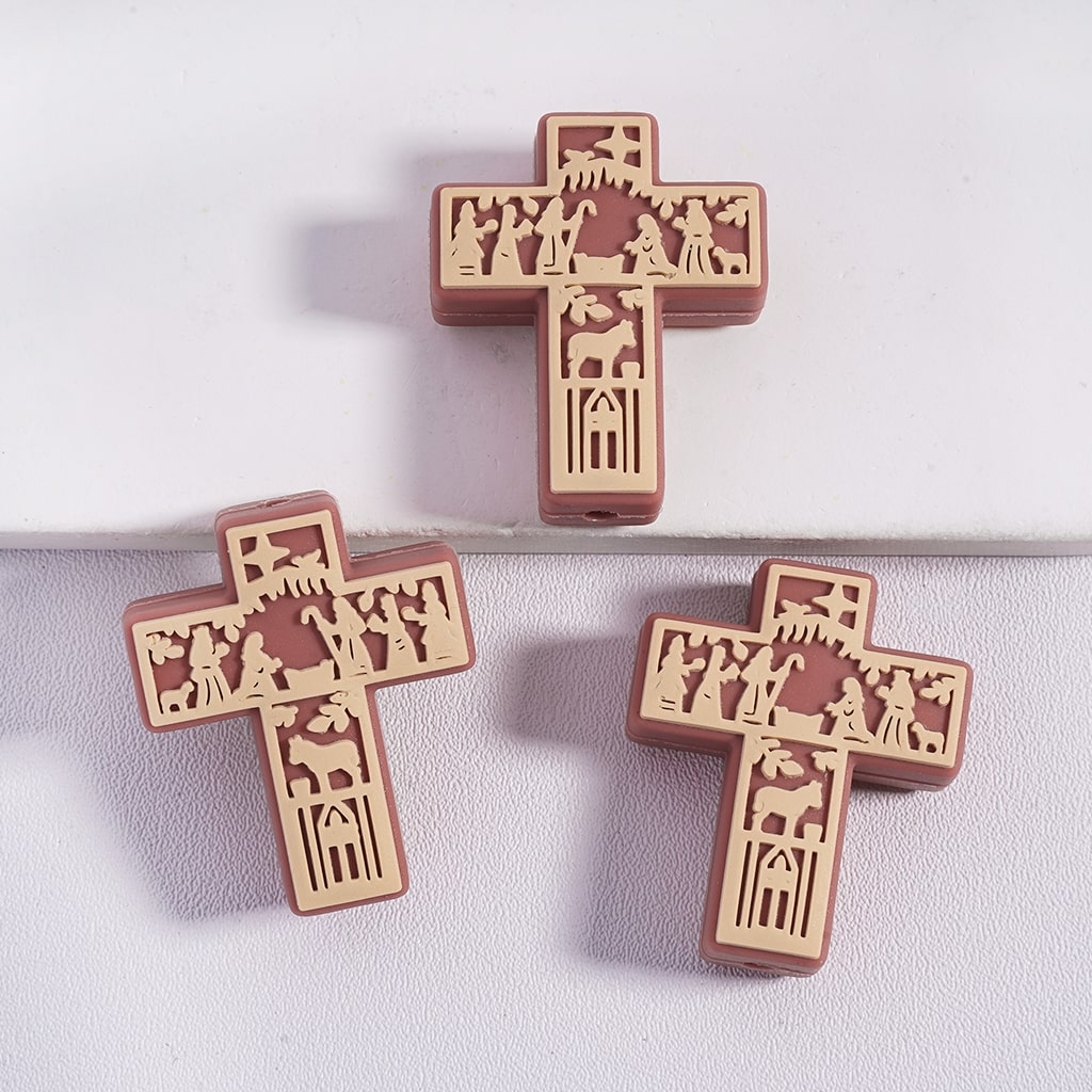 Three wooden crosses with carvings on a light gray background