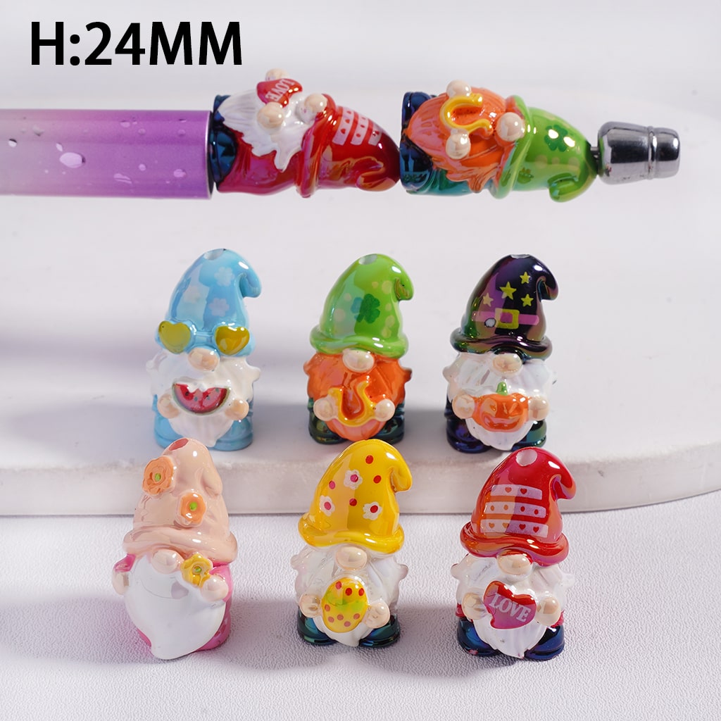 Colorful gnome figurines with a pen on a white background