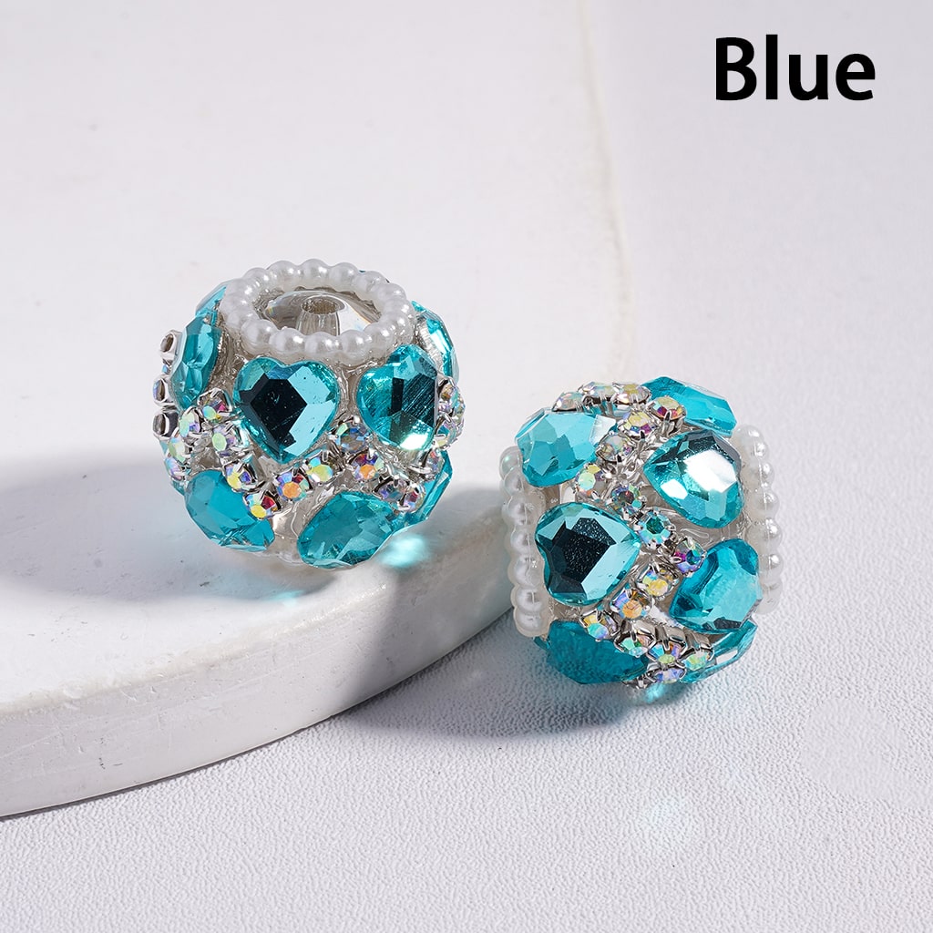 Blue beaded earrings on a white surface with 'Blue' text above.