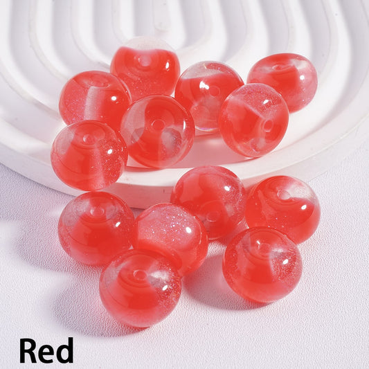 Red beads on a white textured surface with 'Red' label.