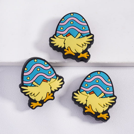 Three colorful gnome-shaped pins with blue hats on a white background