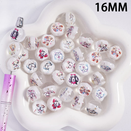 Set of decorative beads with cartoon characters on a white tray, with a pink tool next to them.