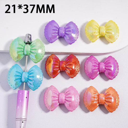 Colorful bow-shaped hair clips on a white background with dimensions 21*37MM.