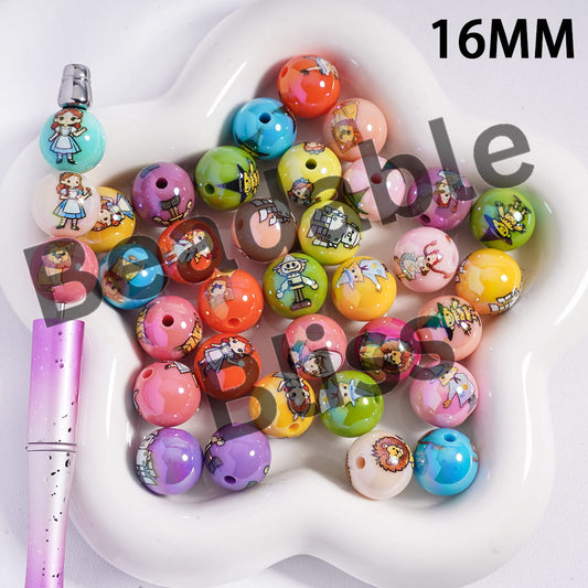 Colorful cartoon-themed beads on a white heart-shaped tray with a pink pen.