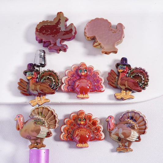 Collection of colorful turkey-shaped items on a white background