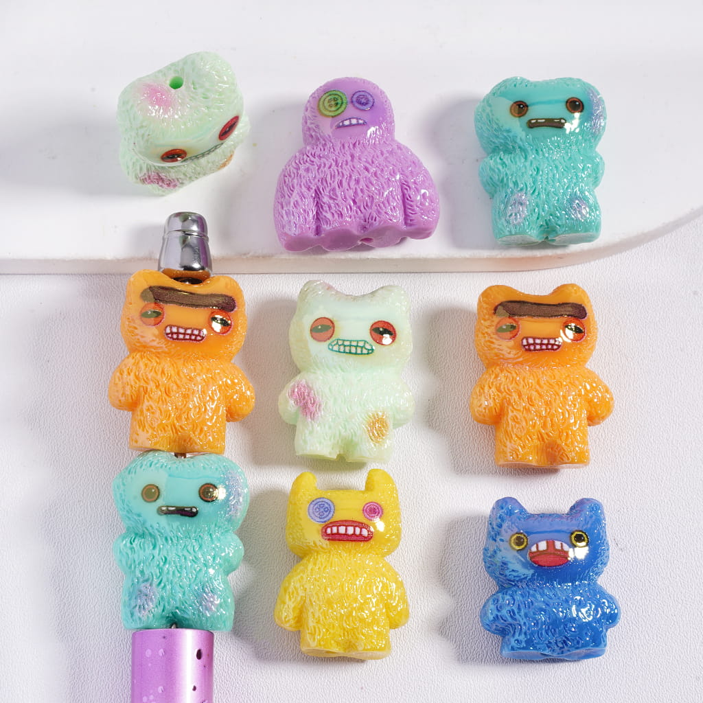 Colorful cartoon-like character erasers on a white background