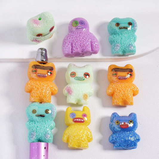 Colorful cartoon-like character erasers on a white background
