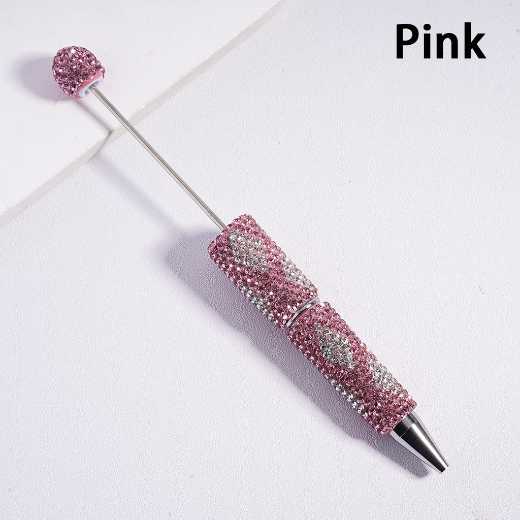 Pink pen with decorative cap on a white background