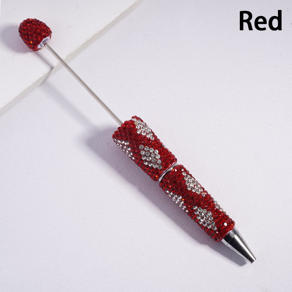 Decorative pen with red and silver design on a white background