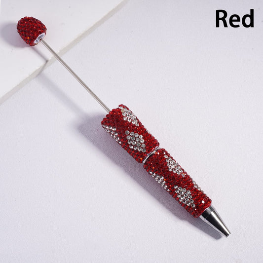 Decorative pen with red and silver design on a white background