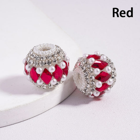 Two red and silver beads on a white surface with 'Red' text.