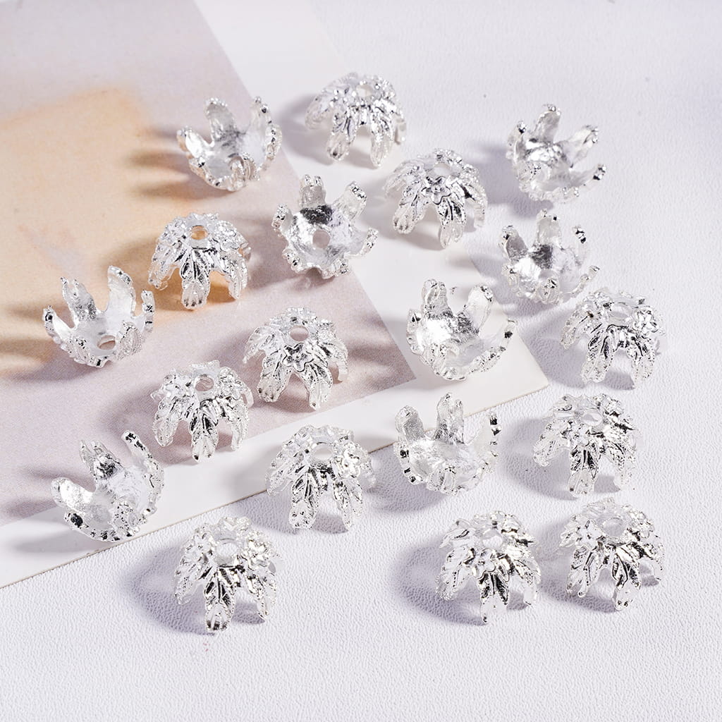 Set of clear crystal rhinestone embellishments on a light background