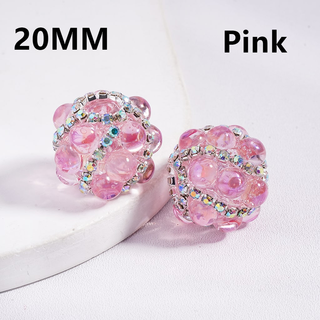 Pink beaded earrings with rhinestones on a white background

