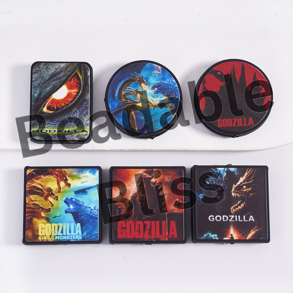 Set of Godzilla-themed coasters on a white background with 'hollisupply.' branding.