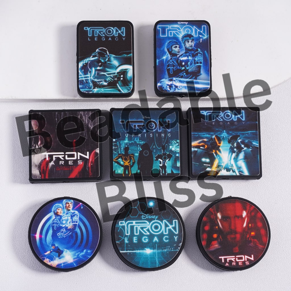 Collection of 'TRON' themed coasters on a white background