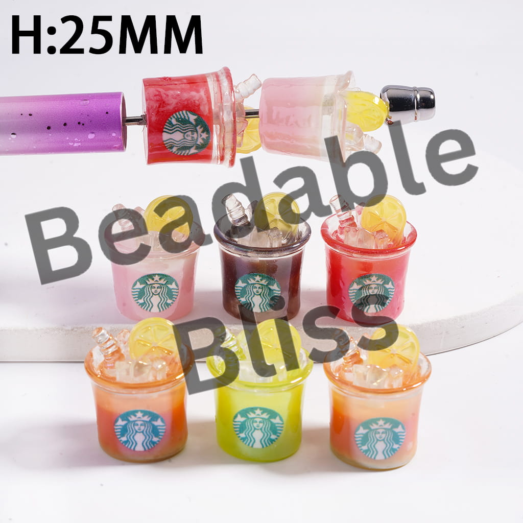 Colorful Starbucks drinks in small cups with lids on a white background.