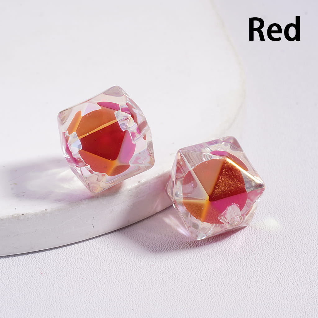 Crystal-like geometric earrings on a white background with 'Red' text.

