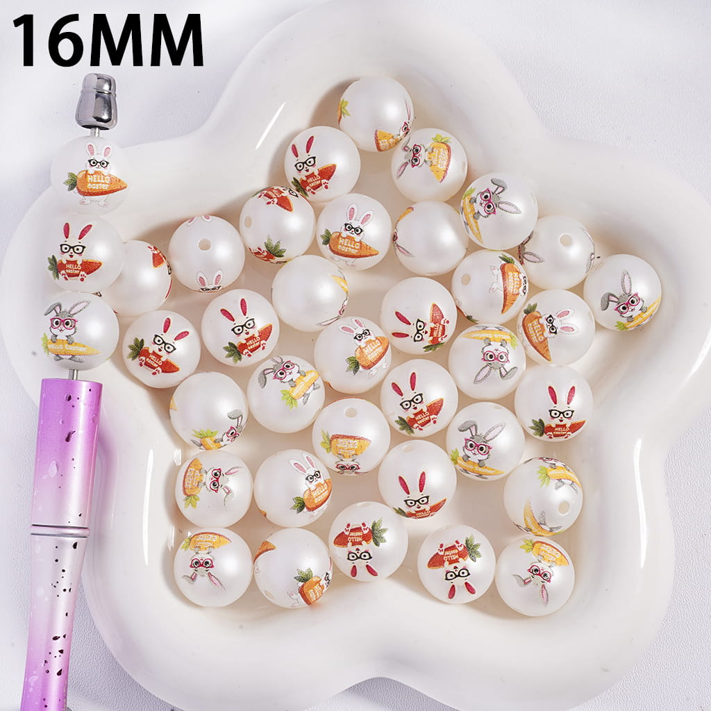 16MM white beads with cartoon designs on a white dish with a purple pen.