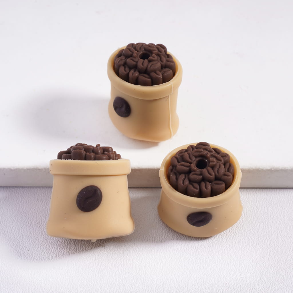 Three beige containers with brown coffee bean-like objects on a white background