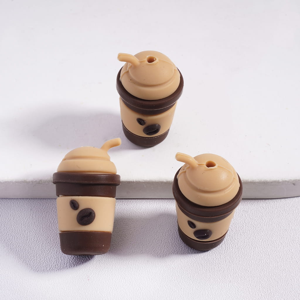 Three coffee cup-shaped objects with lids on a white background