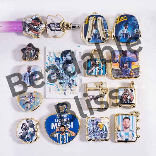 Collection of keychains with images of a famous soccer player on a white background
