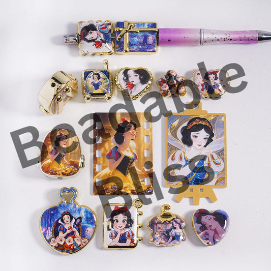Collection of Snow White-themed jewelry and accessories on a white background.