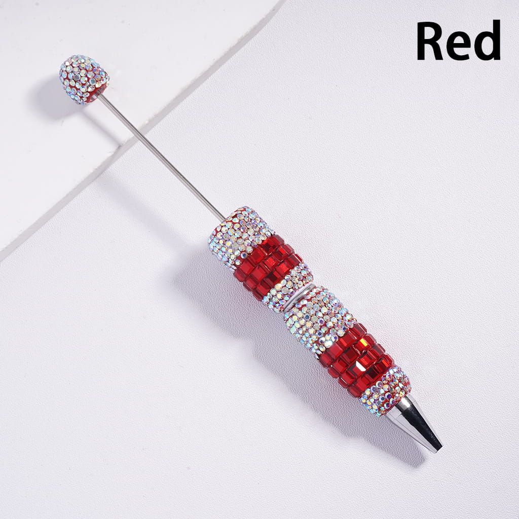 Decorative pen with red and silver design on a light gray background