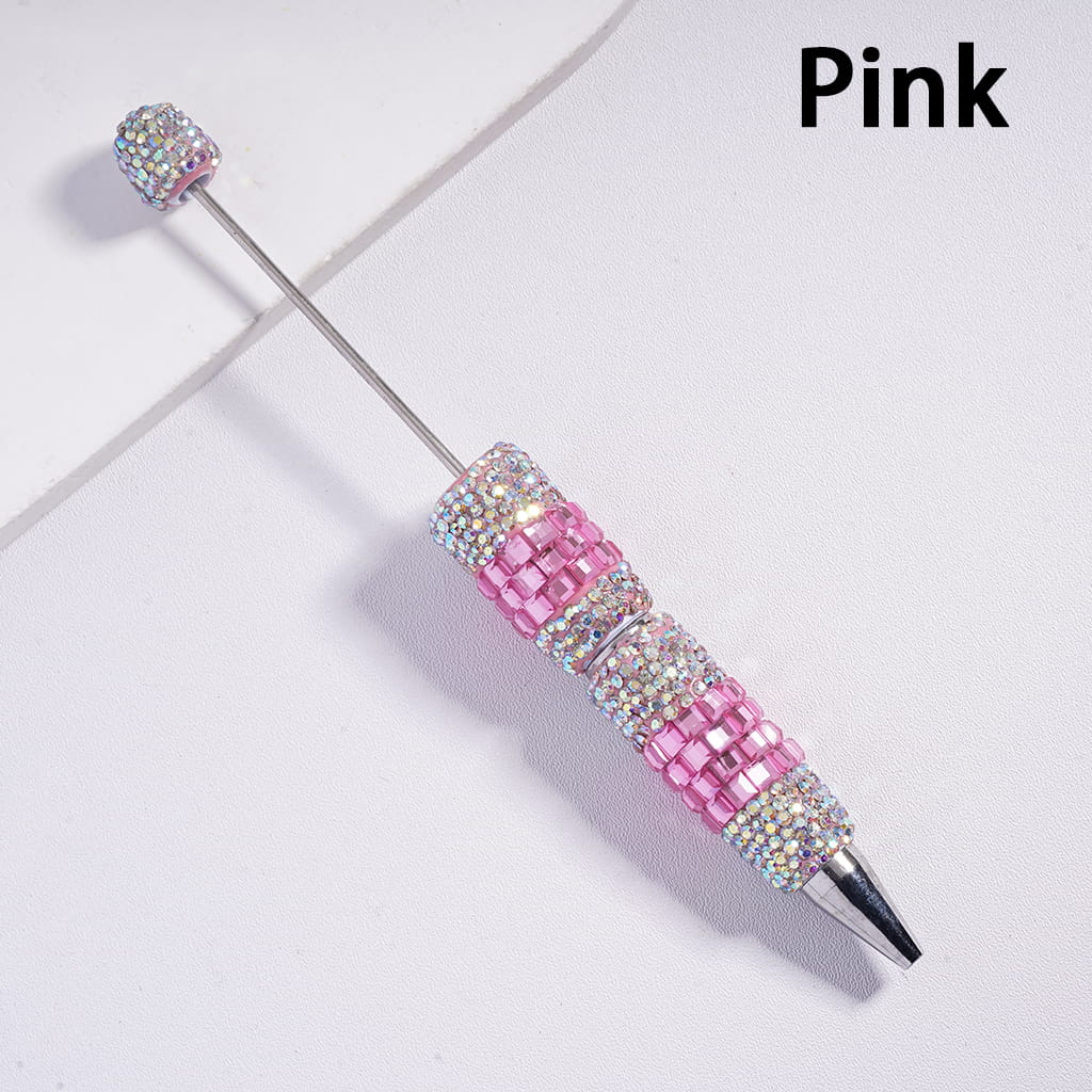 Pink and silver decorative pen on a light gray background