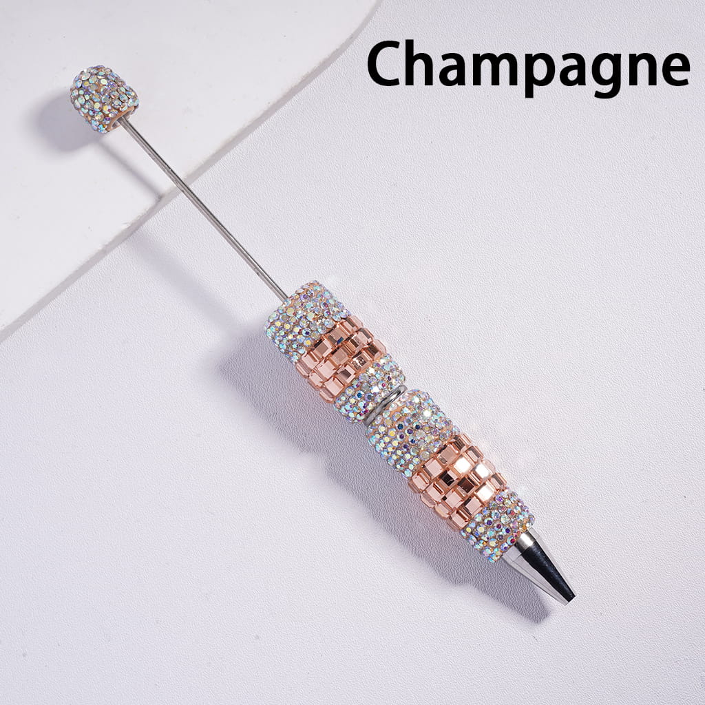 Decorative cocktail stirrer with rhinestone embellishments on a light background, labeled 'Champagne'.