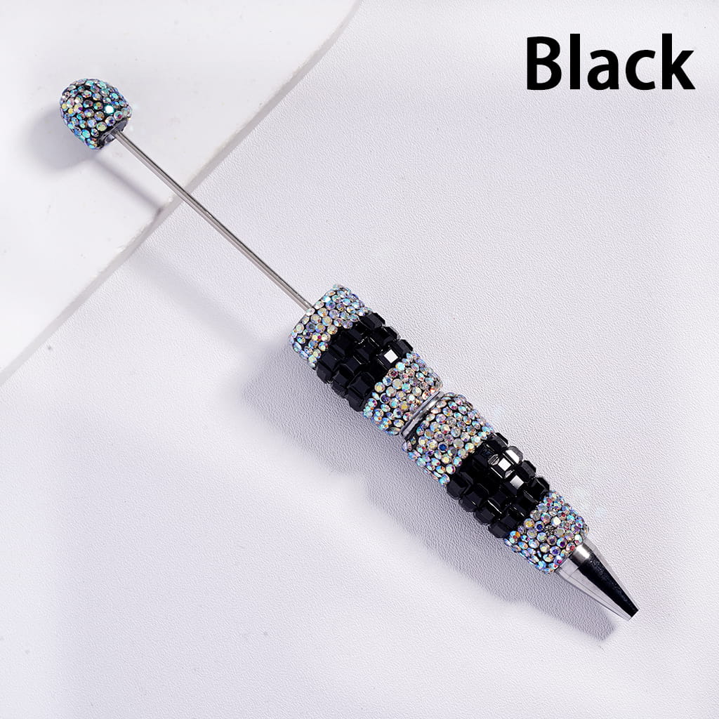 Decorative pen with gemstones on a white background, labeled 'Black'.