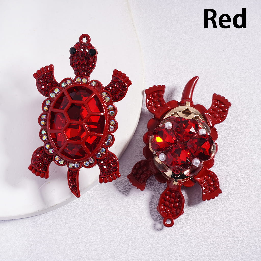 Red turtle-shaped earrings on a white background with 'Red' text.