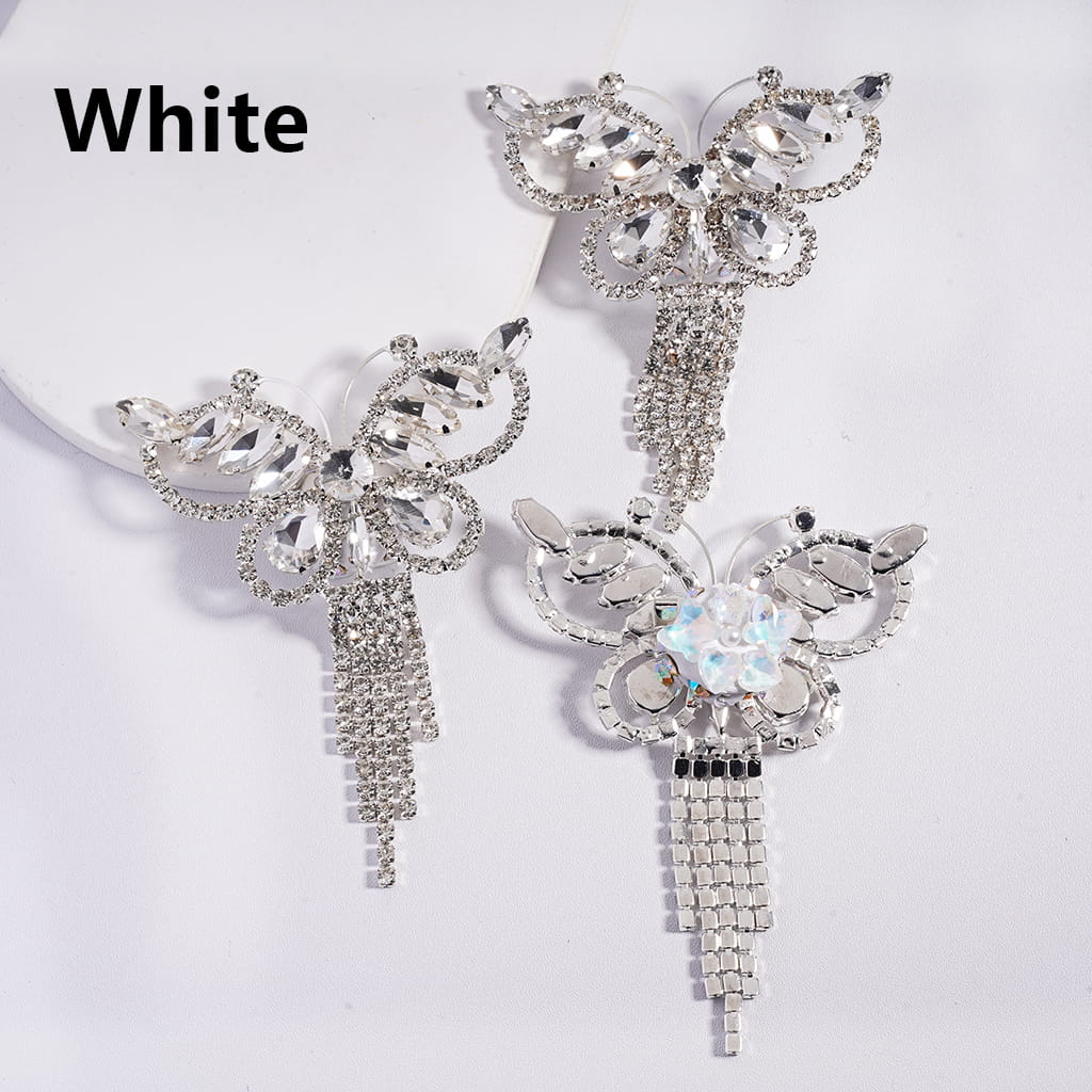 A collection of pens with silver alloy butterflies and sparkling rhinestones in various colors including blue, black, red, purple, and pink.

