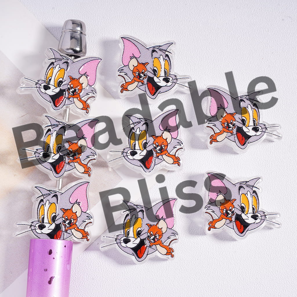 Cartoon character hair clips with a visible brand name on a white background