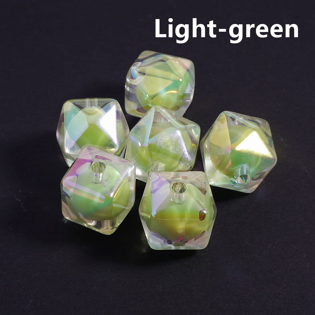 Set of light-green polyhedral dice on a black background


