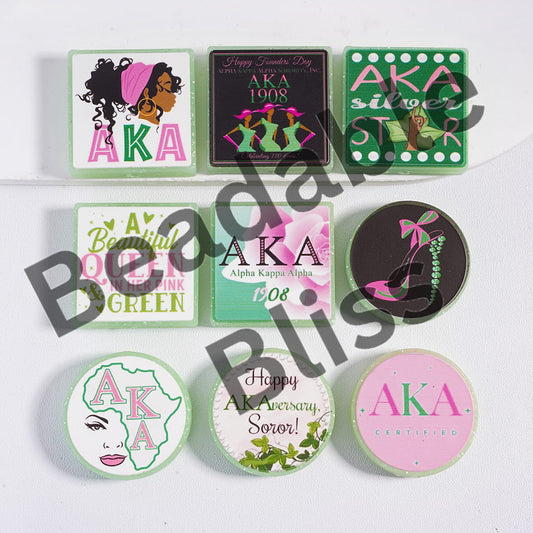 Collection of AKA-themed coasters on a white background