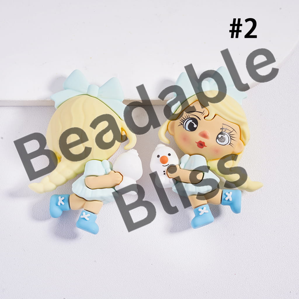 Two cartoon-style character earrings with a snowman on a white background, branded 'handsontosupply.com'.