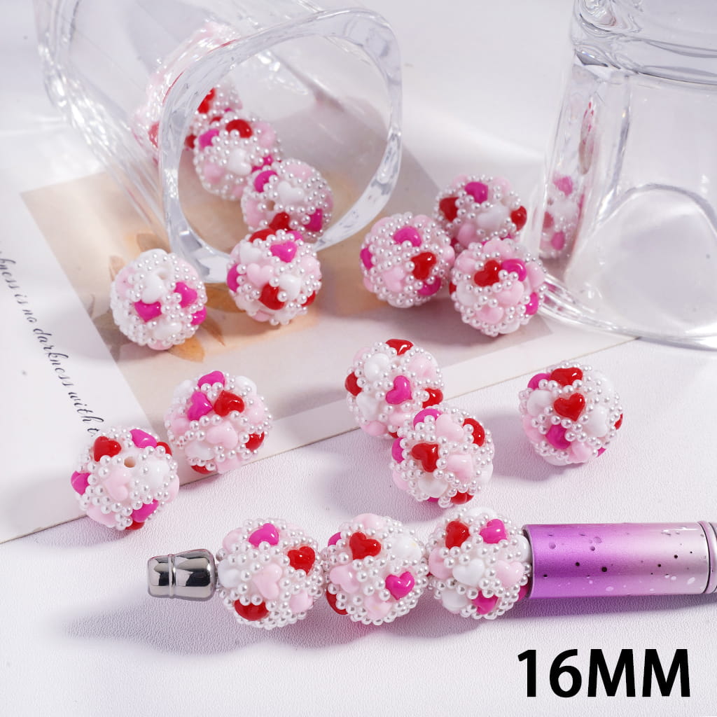 Pink and white beaded pen on a light background