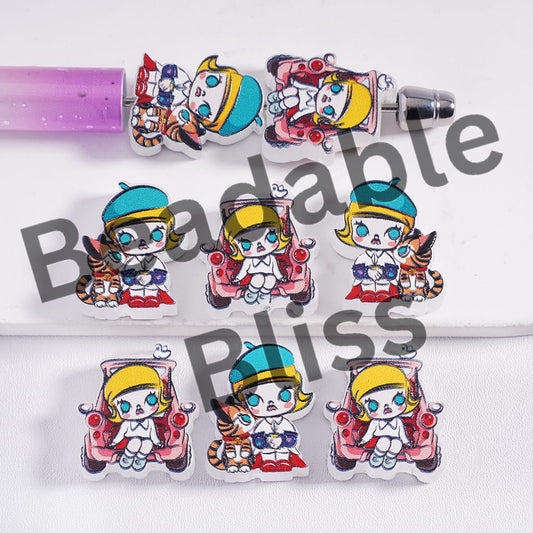 Cartoon character earrings with colorful design on a white background