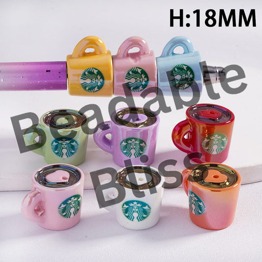Colorful Starbucks-themed ceramic mugs with lids on a white background