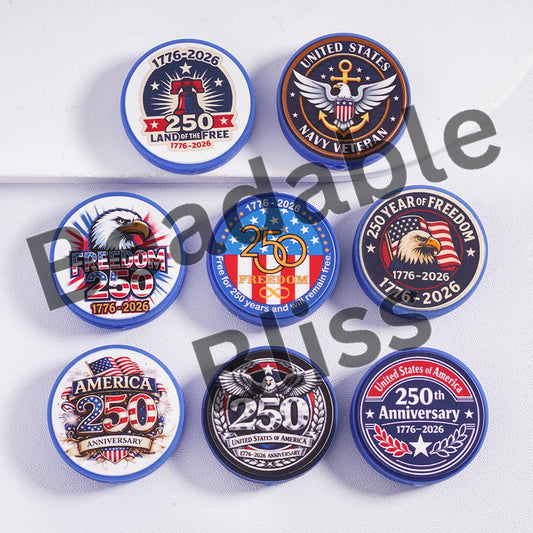 Collection of commemorative coins with various designs on a white background