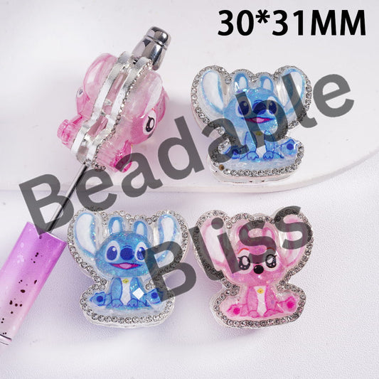 Four decorative charms featuring cartoon characters on a white background with 'handsontable' branding.