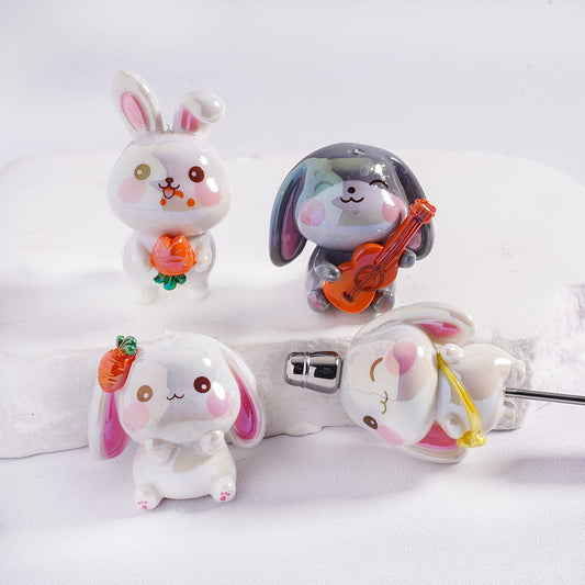 Set of cute rabbit-shaped earphone holders on a white background