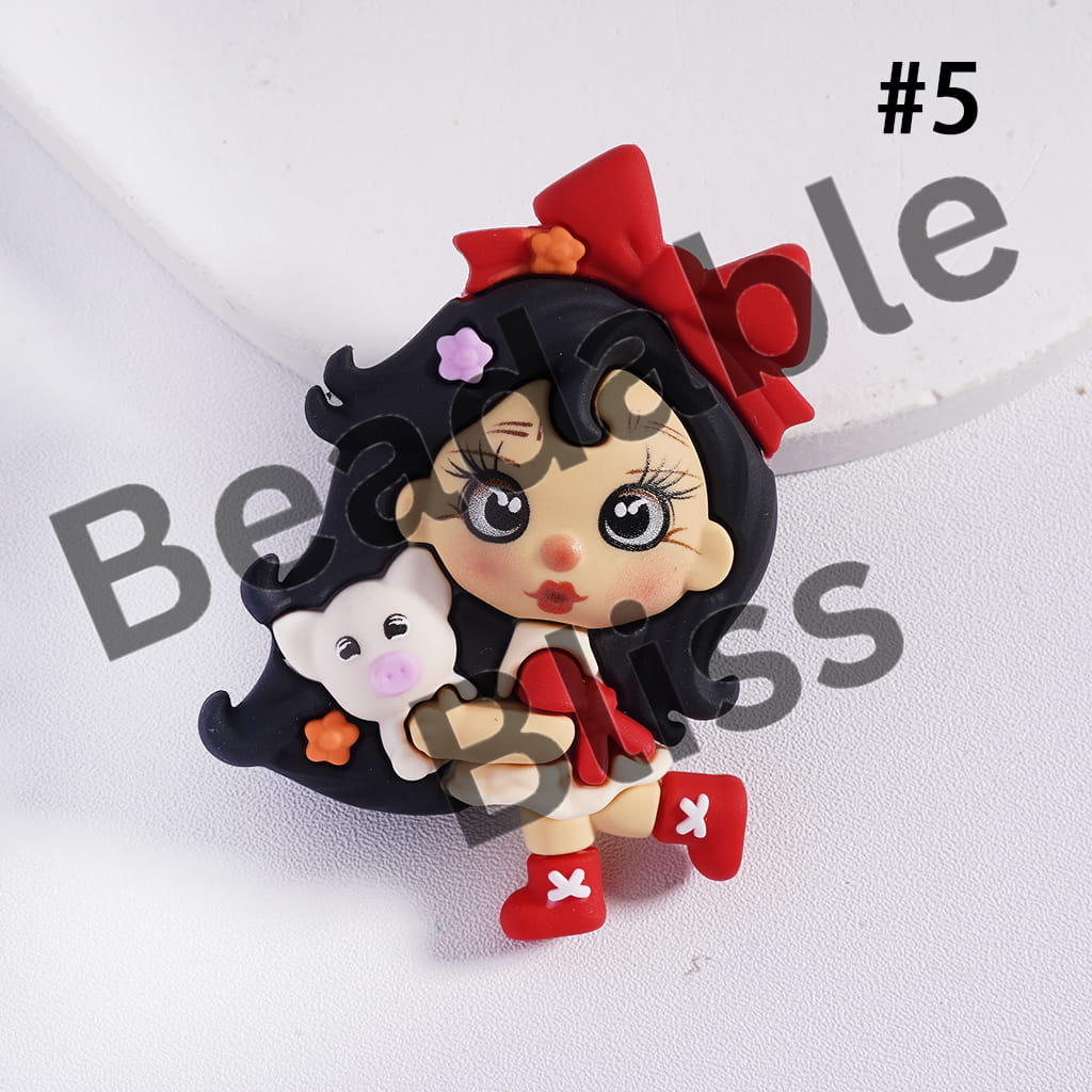 Fimo clay figurine of a girl with black hair and a red bow, holding a white ghost, on a white background.