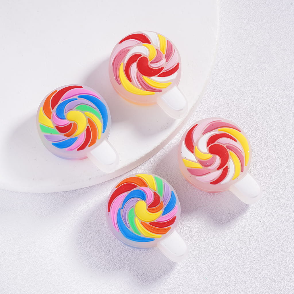 Colorful swirl-shaped lollipops on a white background