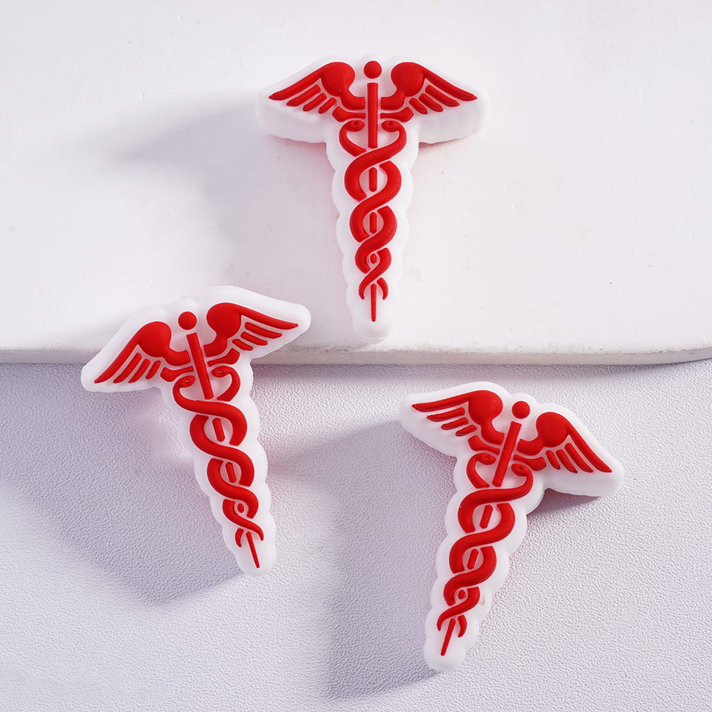 Red caduceus symbols on white background